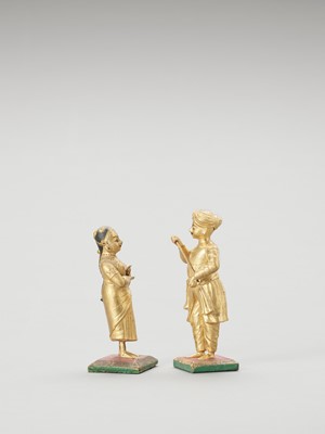 Lot 1246 - A PAIR OF GILT INDIAN WOOD DOLLS, C.1900-1920
