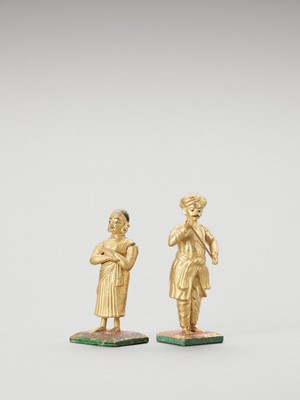 Lot 1246 - A PAIR OF GILT INDIAN WOOD DOLLS, C.1900-1920