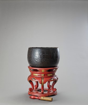 Lot 9 - A BUDDHIST BRONZE GONG ON A LACQUERED WOOD STAND