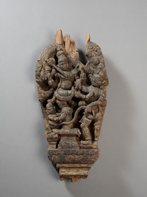 Lot 571 - A LARGE NEPALESE WOOD STELE OF DURGA VANQUISHING A DEMON, 17th -18TH CENTURY