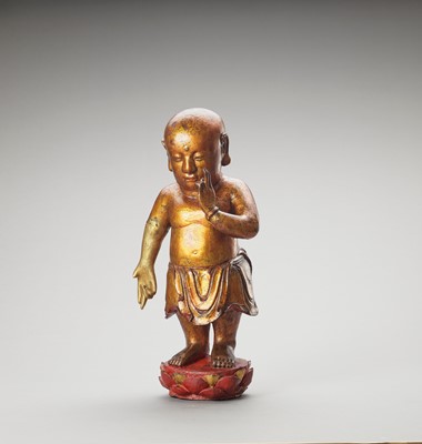Lot 1195 - A VIETNAMESE GILT-LACQUERED WOOD FIGURE OF BUDDHA AS A CHILD