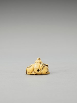 Lot 343 - AN EARLY IVORY NETSUKE OF ROSHI WITH OX