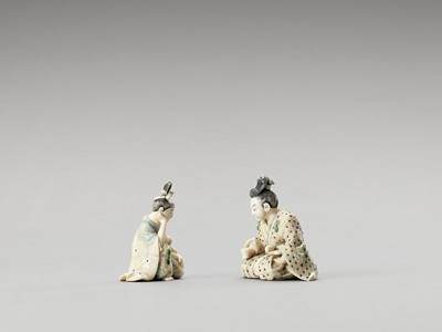 Lot 153 - TWO STAINED IVORY OKIMONO OF A SAMURAI AND A PRINCESS
