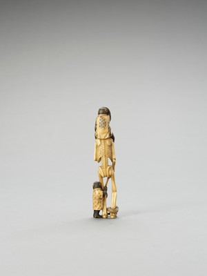 Lot 128 - AN IVORY OKIMONO OF A SKELETON WITH TWO MONKEYS AND SNAKE