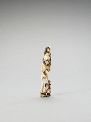 Lot 128 - AN IVORY OKIMONO OF A SKELETON WITH TWO MONKEYS AND SNAKE
