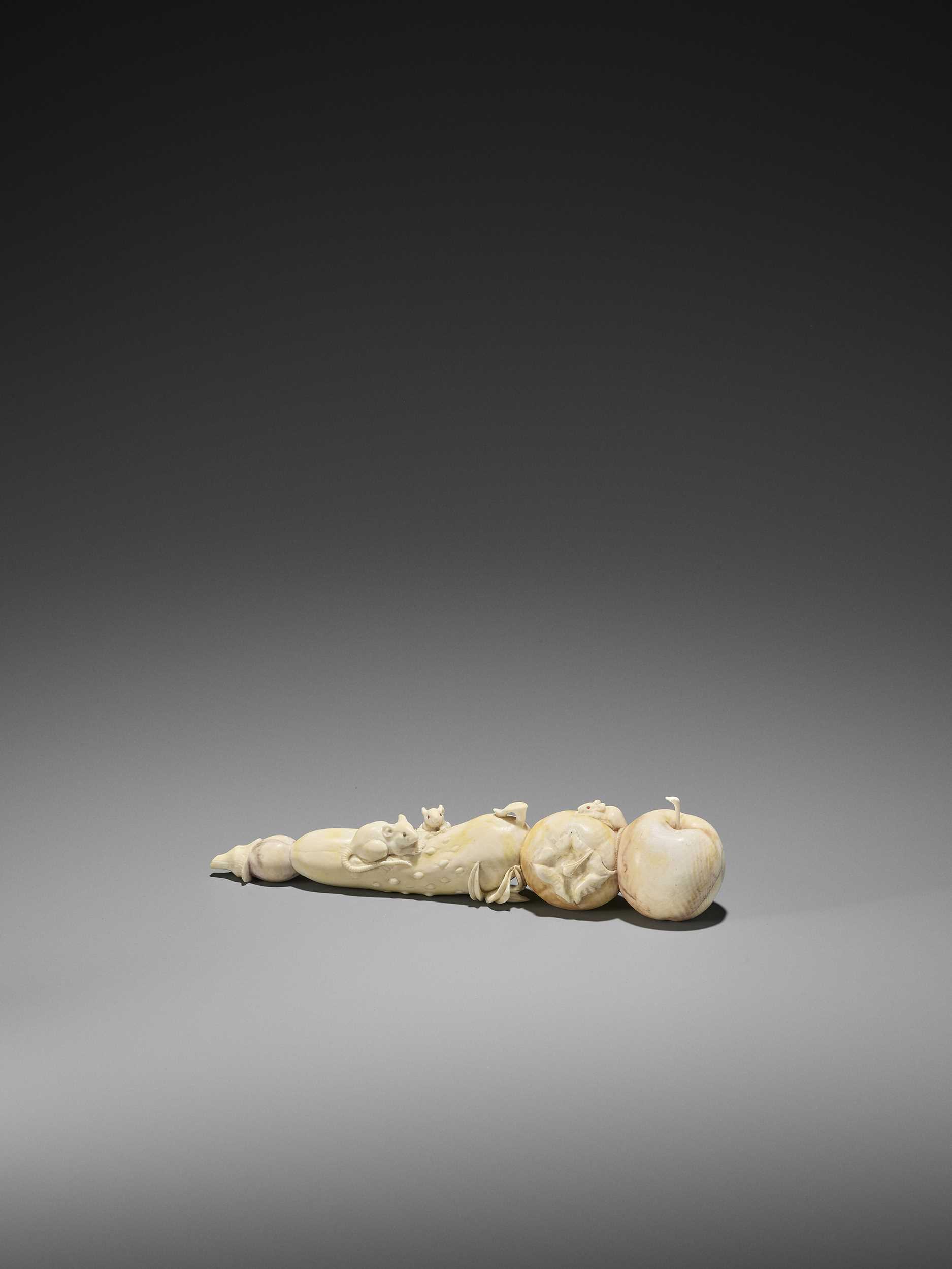 Lot 115 - AN IVORY OKIMONO OF THREE RATS ON A GROUP OF VEGETABLES AND FRUIT