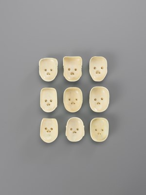 Lot 175 - A LOT WITH NINE SMALL IVORY MASKS