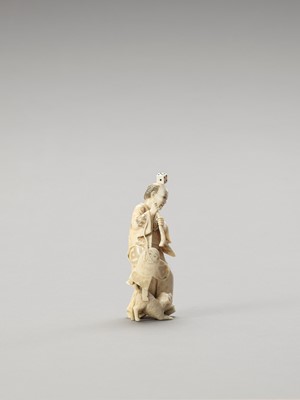 Lot 146 - AN UNUSUAL IVORY OKIMONO OF A MAN AND DOG