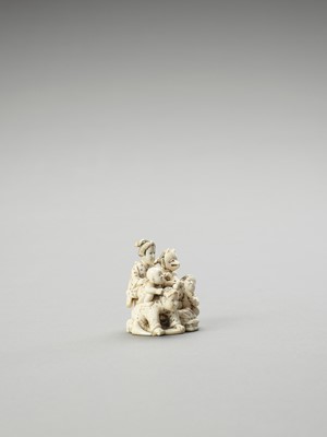 Lot 163 - AN IVORY OKIMONO OF A WOMAN AND CHILDREN AT PLAY