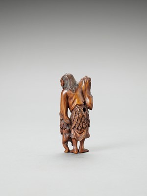 Lot 314 - A WOOD NETSUKE OF A SENNIN WITH ONI