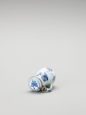 Lot 1106 - A SILVER-MOUNTED BLUE AND WHITE PORCELAIN JUG