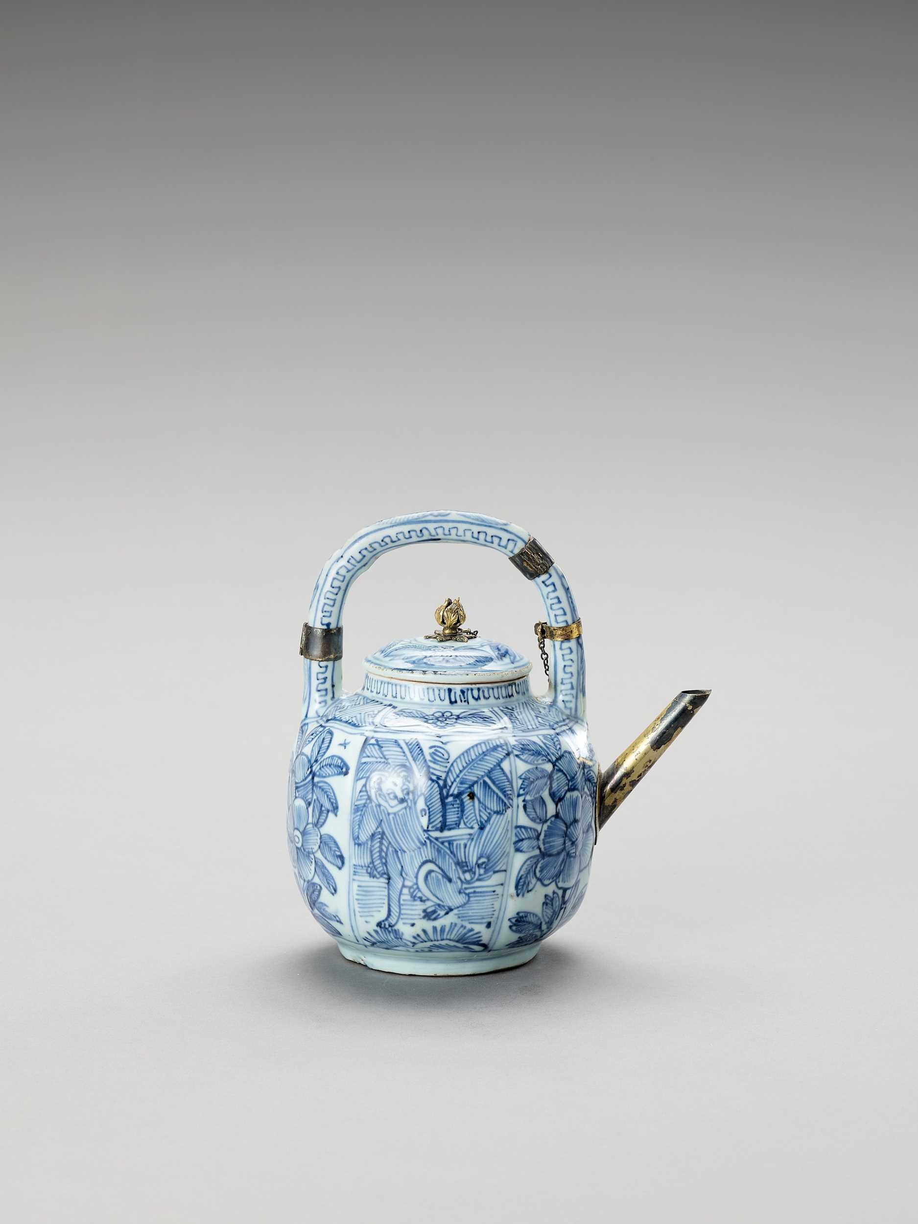 Lot 1086 - A SILVER-MOUNTED BLUE AND WHITE PORCELAIN TEAPOT