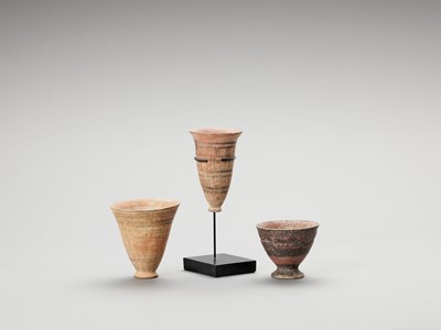 Lot 1161 - THREE CERAMIC MEHRGARH AND HARAPPAN DRINKING CUPS