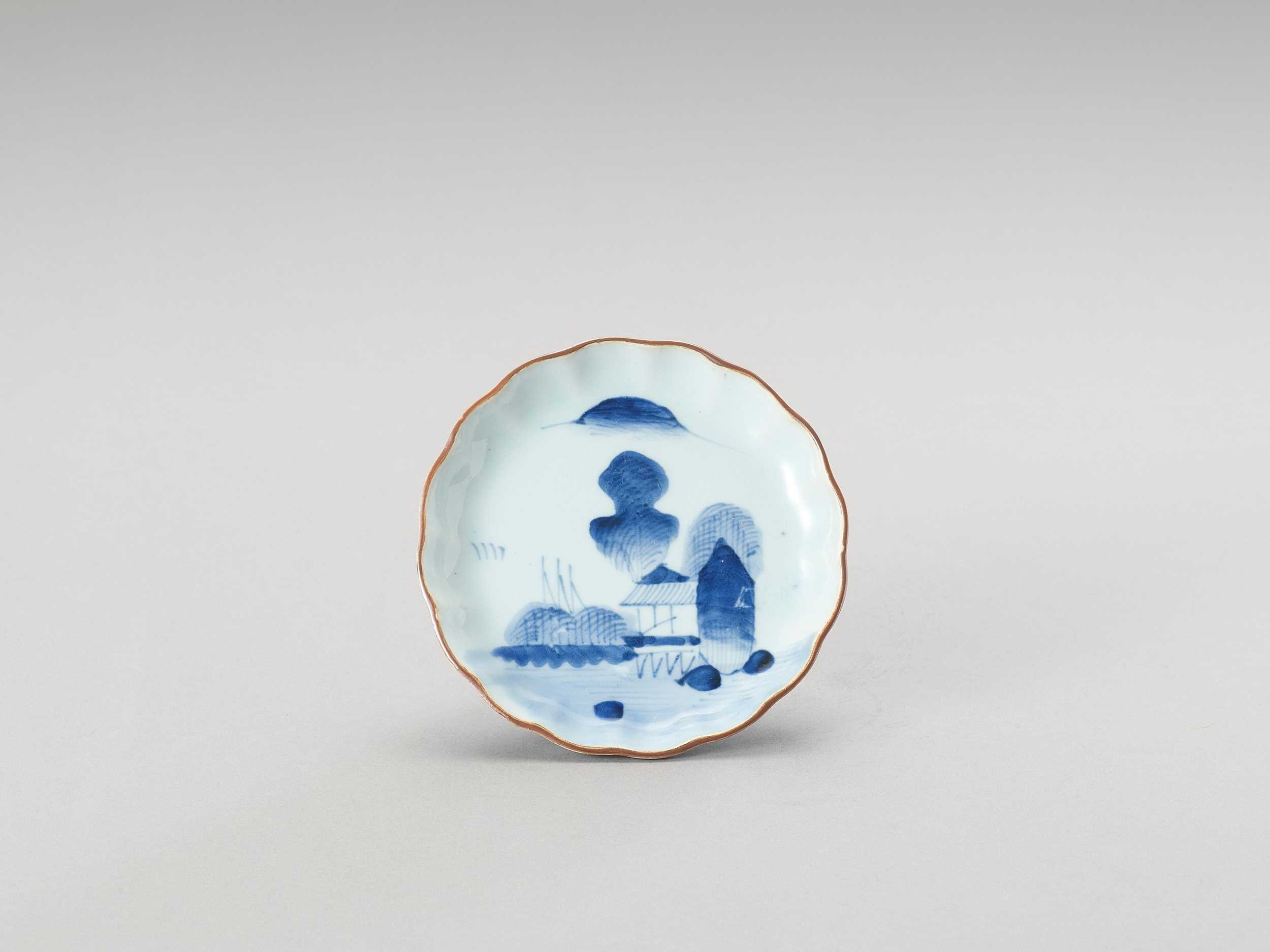 A SMALL BLUE AND WHITE LOBED PORCELAIN DISH