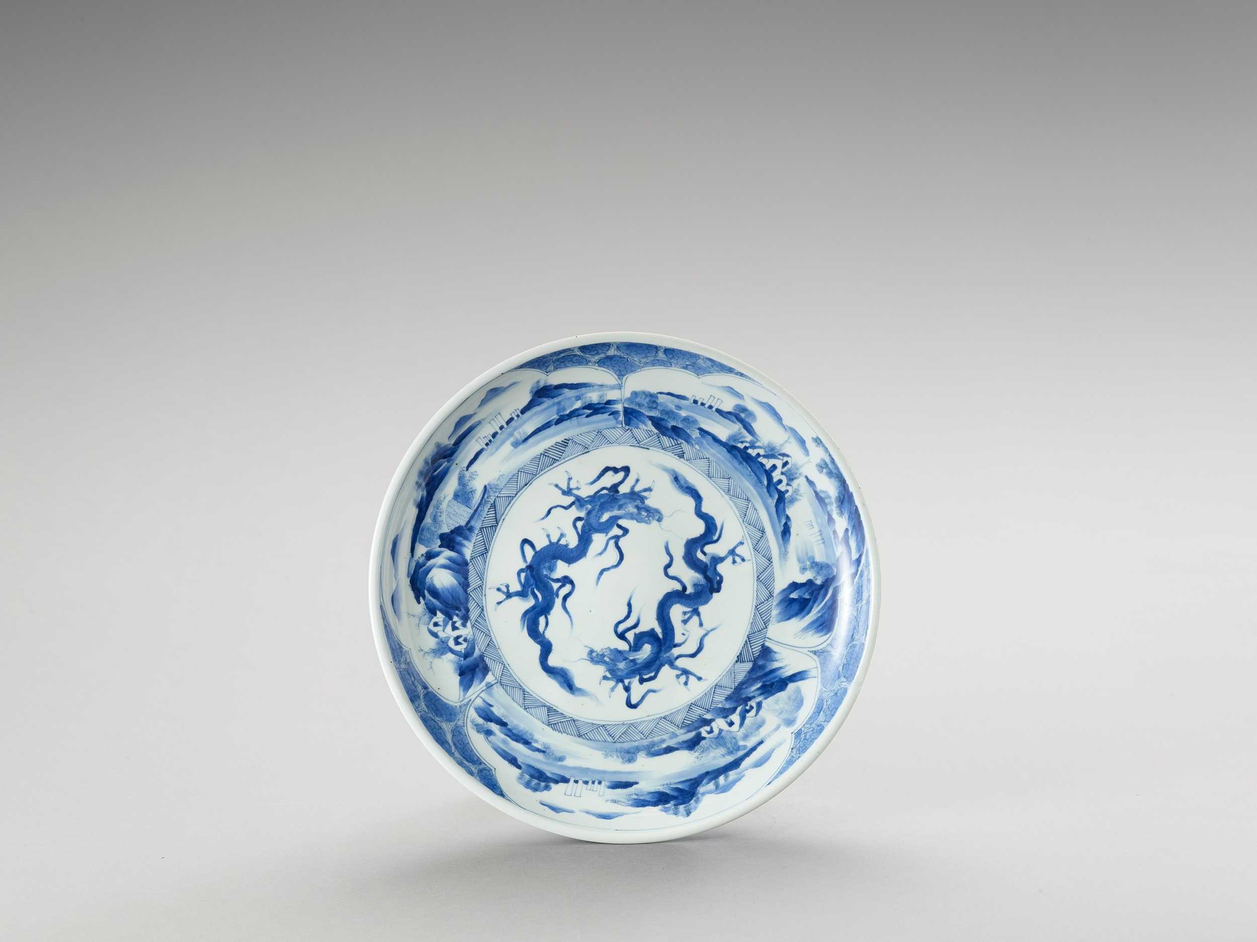 Lot 1016 - A BLUE AND WHITE PORCELAIN ‘DRAGON’ PLATE