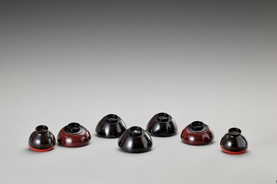 Lot 67 - A SET OF SEVEN LACQUERED BOWLS WITH COVERS