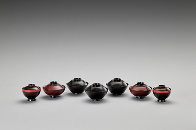 Lot 67 - A SET OF SEVEN LACQUERED BOWLS WITH COVERS