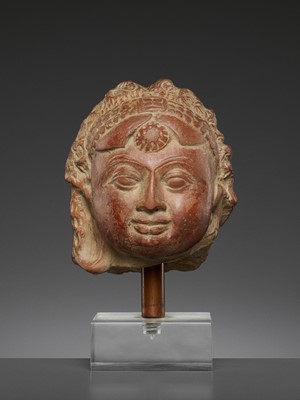 Lot 731 - A JAMMU TERRACOTTA HEAD OF A FEMALE DEITY, 6TH-7TH CENTURY