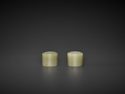 Lot 105 - A PAIR OF CELADON JADE ARCHER’S RINGS, QING DYNASTY