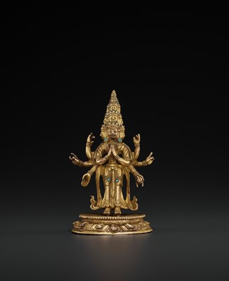 Lot 513 - A GILT-BRONZE FIGURE OF EKADASHAMUKHA AVALOKITESHVARA, 18TH CENTURY