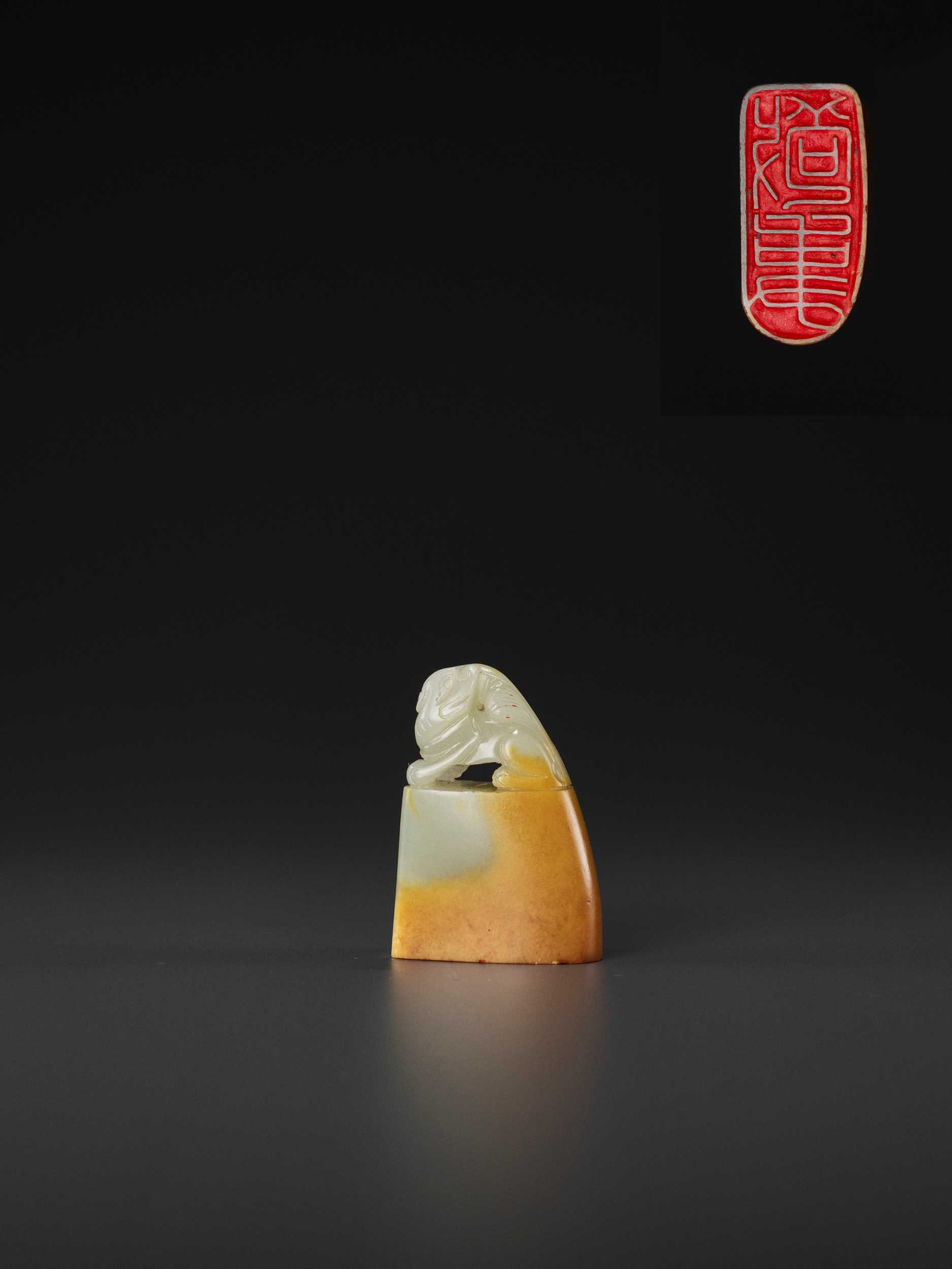 Lot 110 - A PALE CELADON AND AMBER JADE ‘BUDDHIST LION’ SEAL, MID-QING TO REPUBLIC