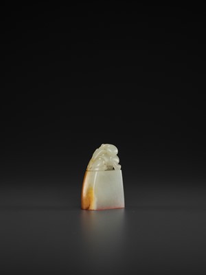 Lot 110 - A PALE CELADON AND AMBER JADE ‘BUDDHIST LION’ SEAL, MID-QING TO REPUBLIC
