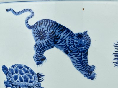 Lot 264 - A MASSIVE BLUE AND WHITE ‘FIVE MYTHICAL BEASTS’ JARDINIERE, QING DYNASTY