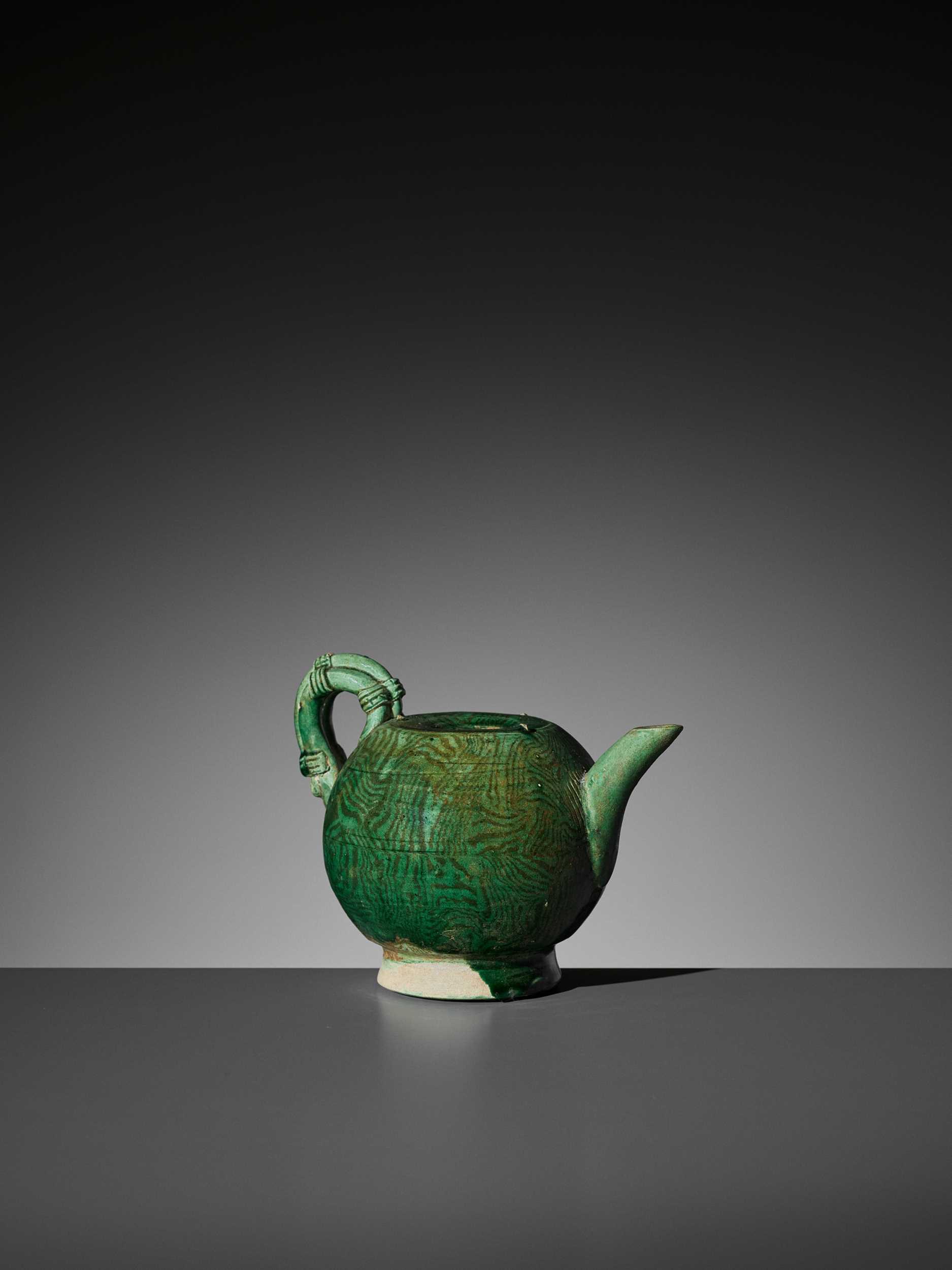 Lot 133 - A GREEN-GLAZED MARBLED TEAPOT, TANG DYNASTY