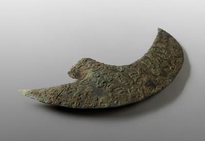 Lot 1288 - AN EXCEPTIONALLY LARGE CRESCENT-SHAPED BRONZE AXE, DONG SON CULTURE