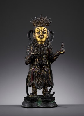 Lot 512 - A PARCEL-GILT BRONZE FIGURE OF VAISRAVANA, MING DYNASTY