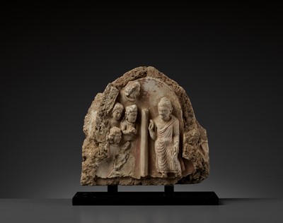 Lot 690 - A GANDHARA STUCCO RELIEF OF BUDDHA, TEACHING HIS DISCIPLES