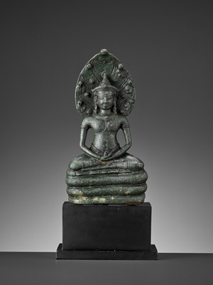 Lot 721 - A KHMER BRONZE FIGURE OF BUDDHA MUCHALINDA, LATE ANGKOR PERIOD