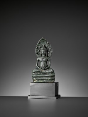 Lot 721 - A KHMER BRONZE FIGURE OF BUDDHA MUCHALINDA, LATE ANGKOR PERIOD