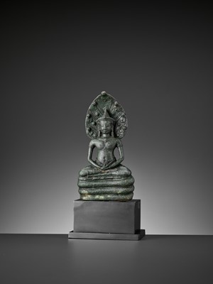 Lot 721 - A KHMER BRONZE FIGURE OF BUDDHA MUCHALINDA, LATE ANGKOR PERIOD