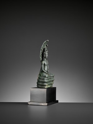 Lot 721 - A KHMER BRONZE FIGURE OF BUDDHA MUCHALINDA, LATE ANGKOR PERIOD