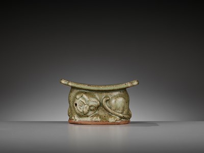 Lot 145 - A YAOZHOU CELADON ‘TIGER’ PILLOW OR WRIST REST WITH OFFICIAL MARK, LATE TANG TO EARLY SONG