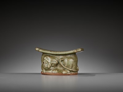Lot 145 - A YAOZHOU CELADON ‘TIGER’ PILLOW OR WRIST REST WITH OFFICIAL MARK, LATE TANG TO EARLY SONG