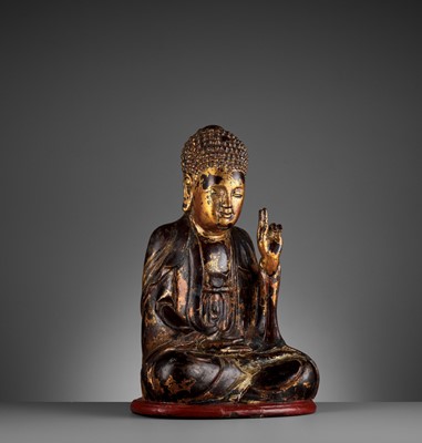 Lot 778 - A VIETNAMESE GILT-LACQUERED WOOD STATUE OF BUDDHA