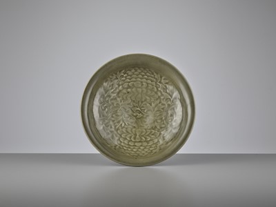 Lot 699 - A YAOZHOU CELADON CARVED ‘PEONY’ SHALLOW BOWL, NOTHERN SONG DYNASTY