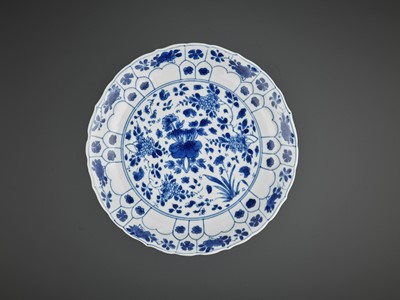 Lot 242 - A BARBED AND MOLDED ‘LOTUS’ DISH, KANGXI MARK AND PERIOD