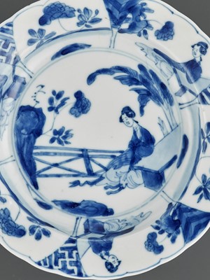 Lot 241 - A BLUE AND WHITE ‘LADY IN A GARDEN’ LOBED DISH, KANGXI MARK AND PERIOD