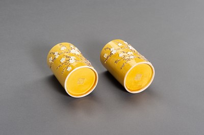 Lot 403 - A PAIR OF YELLOW GLAZED BRUSHPOTS WITH APPLIED DECORATIONS, LATE QING