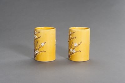 Lot 403 - A PAIR OF YELLOW GLAZED BRUSHPOTS WITH APPLIED DECORATIONS, LATE QING