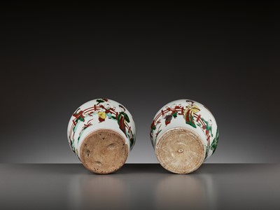 Lot 201 - A PAIR OF IRON-RED AND ENAMEL-DECORATED ‘BOYS’ JARS, TIANQI PERIOD