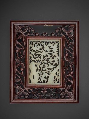 Lot 86 - AN OPENWORK JADE ‘BIRDS AND FLOWERS’ PLAQUE, MING DYNASTY
