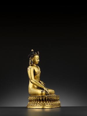 Lot 490 - A GILT COPPER-ALLOY FIGURE OF A CROWNED BUDDHA, MALLA, 14TH - 15TH CENTURY