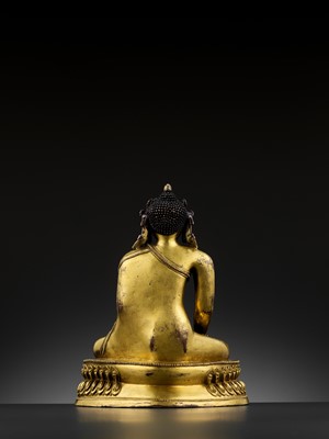 Lot 490 - A GILT COPPER-ALLOY FIGURE OF A CROWNED BUDDHA, MALLA, 14TH - 15TH CENTURY