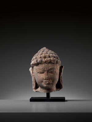 Lot 732 - A JAIN RED SANDSTONE HEAD OF A JINA