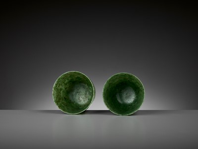 Lot 163 - A PAIR OF SPINACH-GREEN JADE CUPS, QING DYNASTY