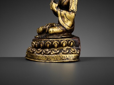 Lot 41 - A GILT BRONZE FIGURE OF A CROWNED BUDDHA, DATED 1709